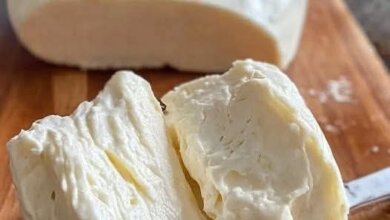 Soak the Cashews: If not pre-soaked, cover 1 cup of raw cashews with water and soak for 4+ hours (or overnight). For a quick soak, use hot water for 20–30 minutes. Blend the Cashews: Drain and rinse the cashews. Blend with coconut milk, water, nutritional yeast, tapioca starch, lemon juice, apple cider vinegar, garlic powder, onion powder, and salt until creamy (1-2 minutes). Add water 1 tbsp at a time if too thick. Cook the Mixture: Pour into a saucepan over medium heat. Stir constantly as it thickens (5–7 minutes) into a gooey, stretchy consistency. Add dissolved agar powder (optional) and cook 2–3 minutes more. Chill (Optional): For a firmer vegan mozzarella, transfer to a bowl, cool to room temperature, cover, and refrigerate for 2+ hours. Serve: Shape into a ball or slice for pizzas, sandwiches, or standalone snacking. Description This vegan mozzarella is a creamy, stretchy dream with a subtle cheesy tang from nutritional yeast and lemon juice. The coconut milk adds richness, while tapioca starch gives it that iconic pull. It’s a plant-based marvel that rivals dairy mozzarella in texture and taste—perfect for a guilt-free indulgence. Nutritional Information (Per 1/4 Cup Serving, Approx.) Calories: 180 Fat: 14g (healthy fats from cashews and coconut) Protein: 4g Carbs: 8g (mostly from starch) Fiber: 1g Sodium: 150mg (adjustable) Note: Nutritional yeast adds B vitamins, making this a nutrient-packed dairy-free option. Conclusion This vegan mozzarella recipe proves you don’t need dairy to enjoy cheesy goodness. It’s simple, customizable, and aligns with the healthful indulgence movement—satisfying cravings while nourishing your body. Recommendation Pair this plant-based mozzarella with a vegan pizza, caprese salad, or grilled sandwich. Store leftovers in an airtight container in the fridge for up to 5 days, or freeze for a month. Reheat gently to restore its stretchy magic! Embracing Healthful Indulgence